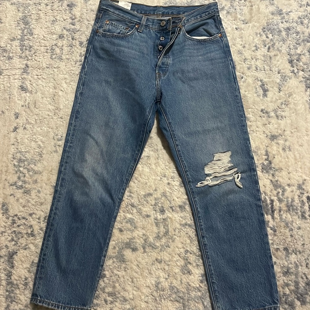 Woman’s Levi 501 cropped jeans.